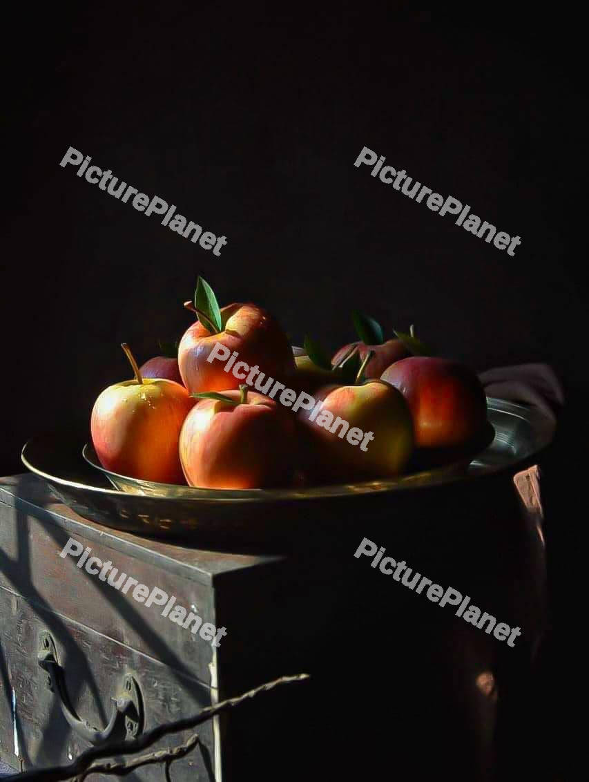 Red apple in a brass bowl